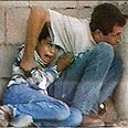 הילד מוחמד א-דורה ואביו (ארכיון) 