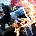 שורפים תמונה של שרון צילום: רויטרס