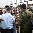 הורים בפתח הבסיס צילום: איי אף פי