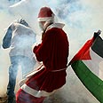 בילעין הפגנה גדר חג מולד (צילום: AFP)