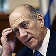 אולמרט, בישיבה צילום: איי אף פי