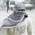 רעול פנים בשועפט, הבוקר צילום: AFP