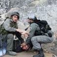מפגין מעוכב בשועפט צילום: AFP