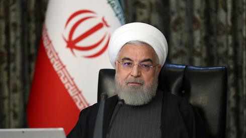 Хасан Рухани. Фото: офис президента Ирана и АР ()